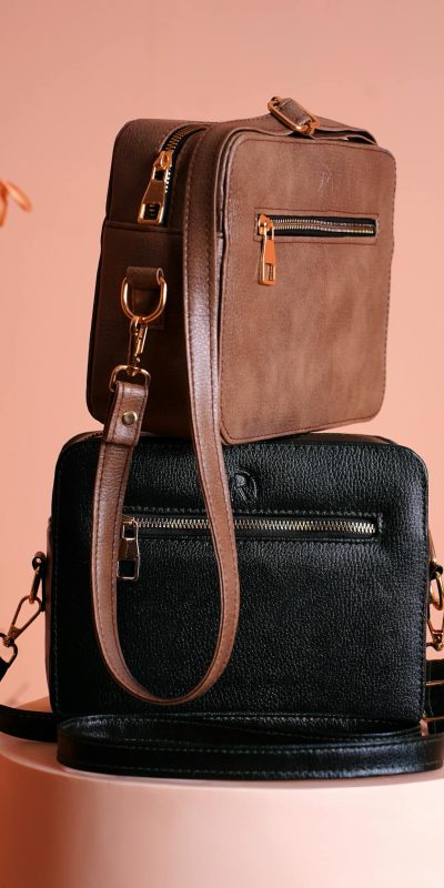 Elegant leather designer bags showcased against a soft background, ideal for fashion displays.