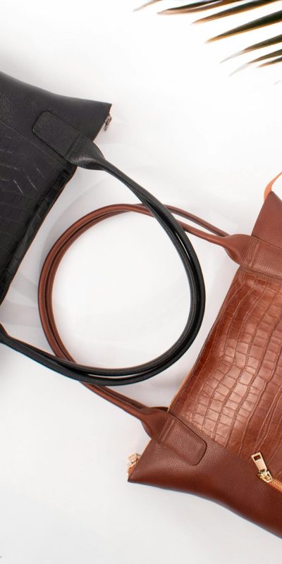 Luxury black and brown leather handbags with crocodile texture, perfect for fashion and lifestyle.