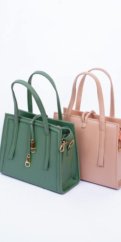 Modern fashion tote bags in green and pink leather, perfect for stylish accessories.