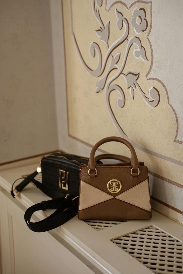 Stylish handbags displayed on a decorative shelf in an elegant Istanbul interior.